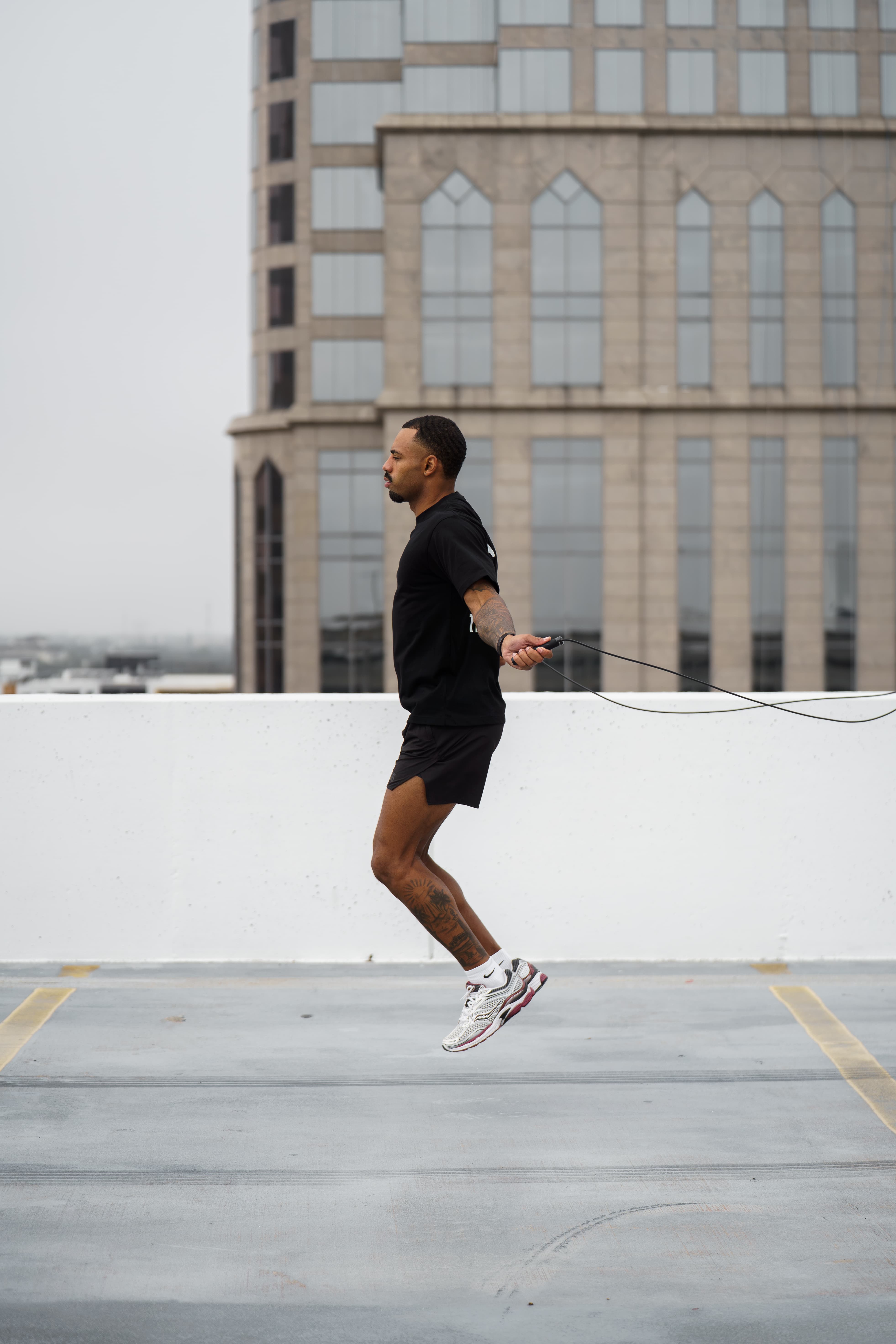 Men wearing athletic fit black gym shirt for training and everyday wear